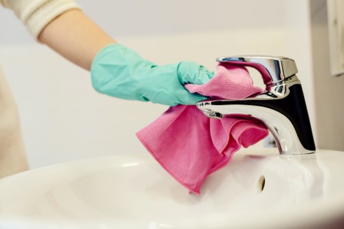 Brompton Cleaners staff working safely in a professional laundry environment